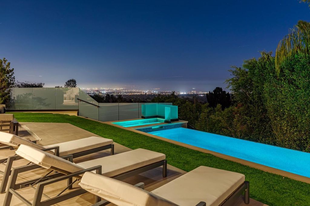 The Los Angeles Home is a stunning three-story architectural masterpiece located on a prestigious street with panoramic ocean views now available for sale. This home located at 815 N Tigertail Rd, Los Angeles, California