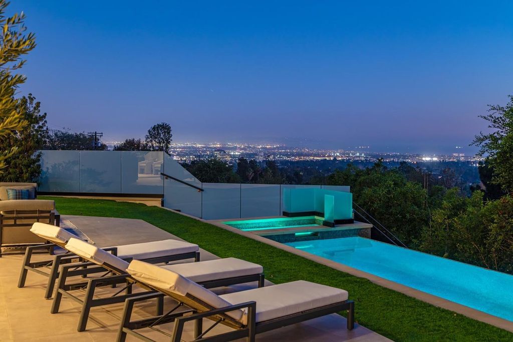 The Los Angeles Home is a stunning three-story architectural masterpiece located on a prestigious street with panoramic ocean views now available for sale. This home located at 815 N Tigertail Rd, Los Angeles, California