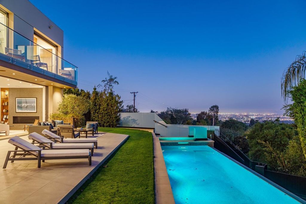 The Los Angeles Home is a stunning three-story architectural masterpiece located on a prestigious street with panoramic ocean views now available for sale. This home located at 815 N Tigertail Rd, Los Angeles, California