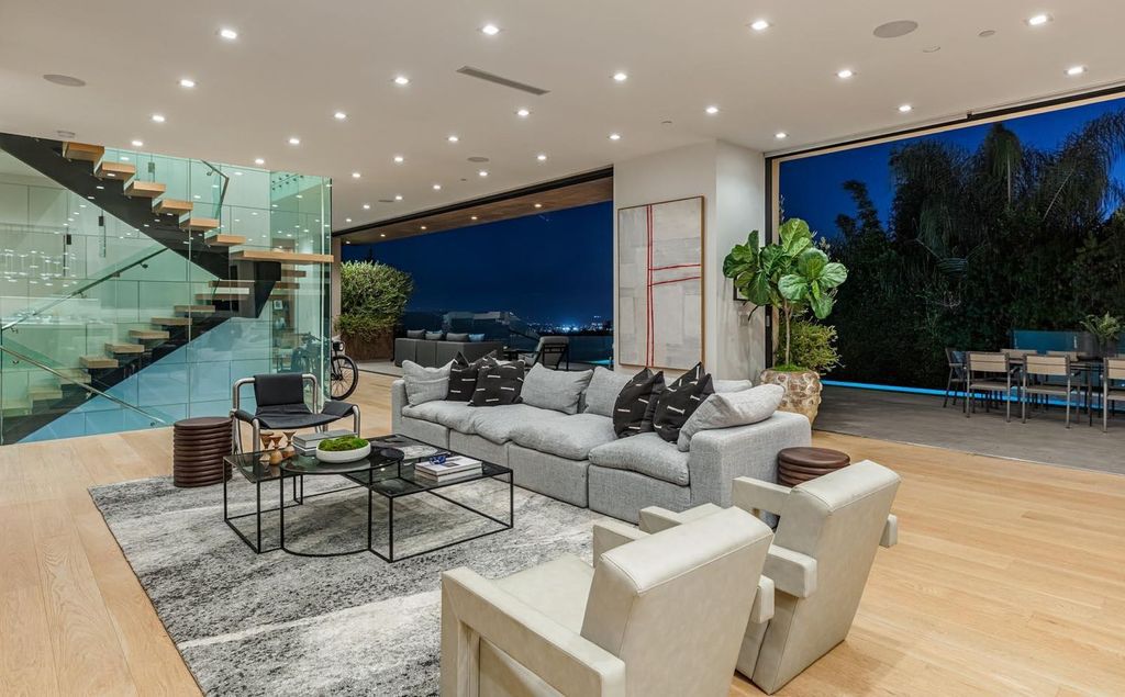 The Los Angeles Home is a stunning three-story architectural masterpiece located on a prestigious street with panoramic ocean views now available for sale. This home located at 815 N Tigertail Rd, Los Angeles, California