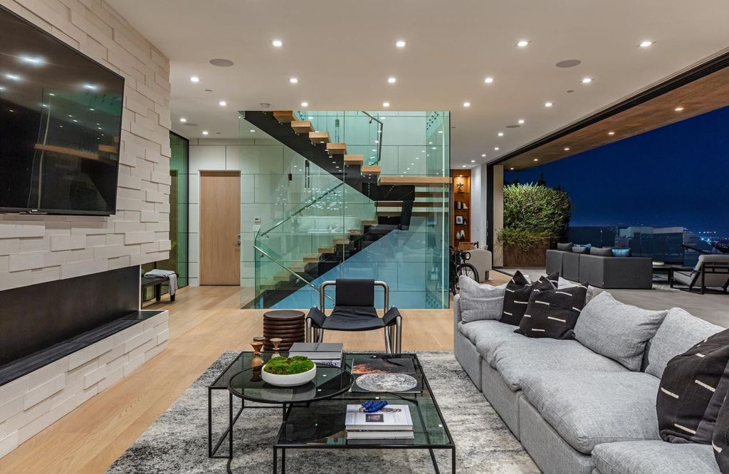 The Los Angeles Home is a stunning three-story architectural masterpiece located on a prestigious street with panoramic ocean views now available for sale. This home located at 815 N Tigertail Rd, Los Angeles, California
