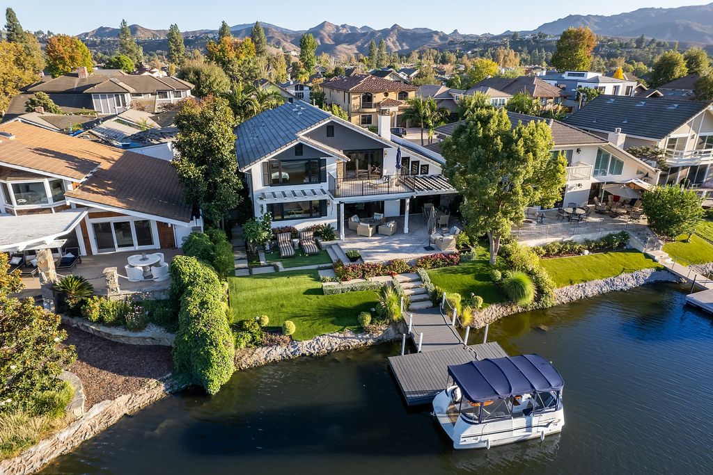 The House in Thousand Oaks is an absolutely stunning modern farmhouse lake front estate with a premier location now available for sale. This home located at 1371 Redsail Cir, Thousand Oaks, California