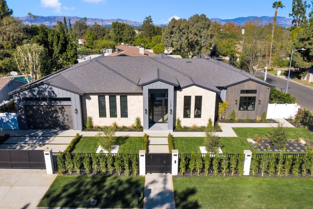 The Modern Farmhouse in Encino perfectly positioned with privacy on a supreme corner lot in Amestoy Estates now available for sale. This home located at 17201 Weddington St, Encino, California