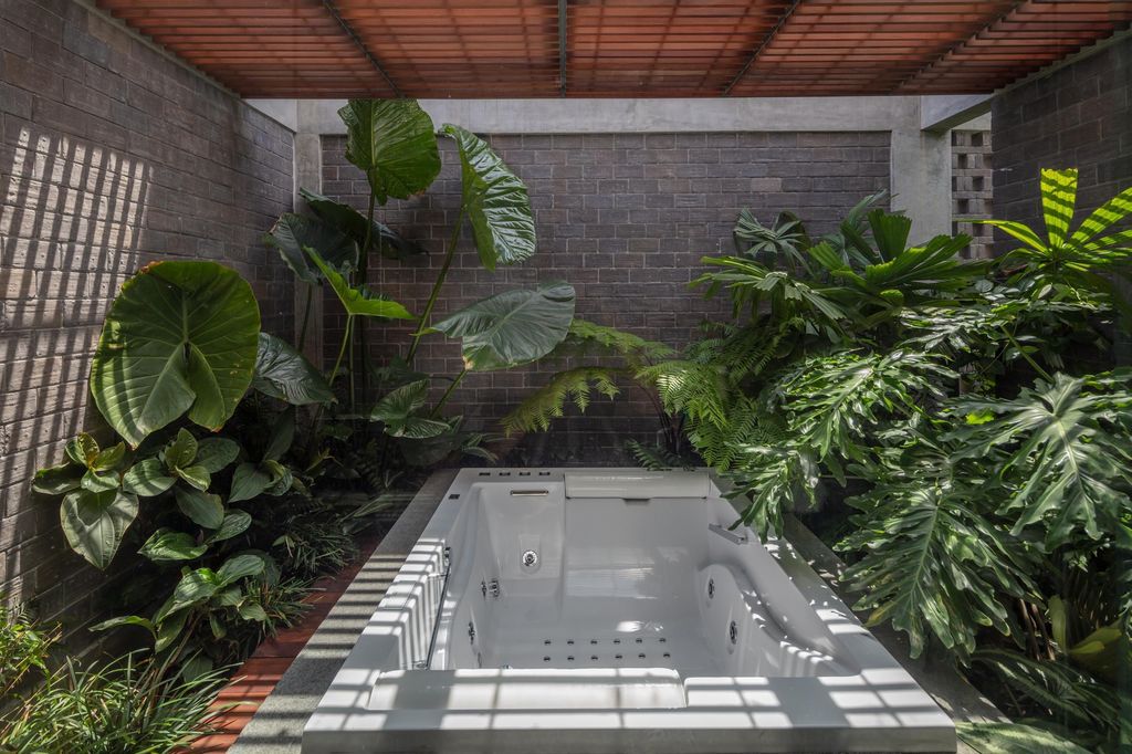Green Revelation House Enveloped by Lush Gardens by HYLA Architects 16