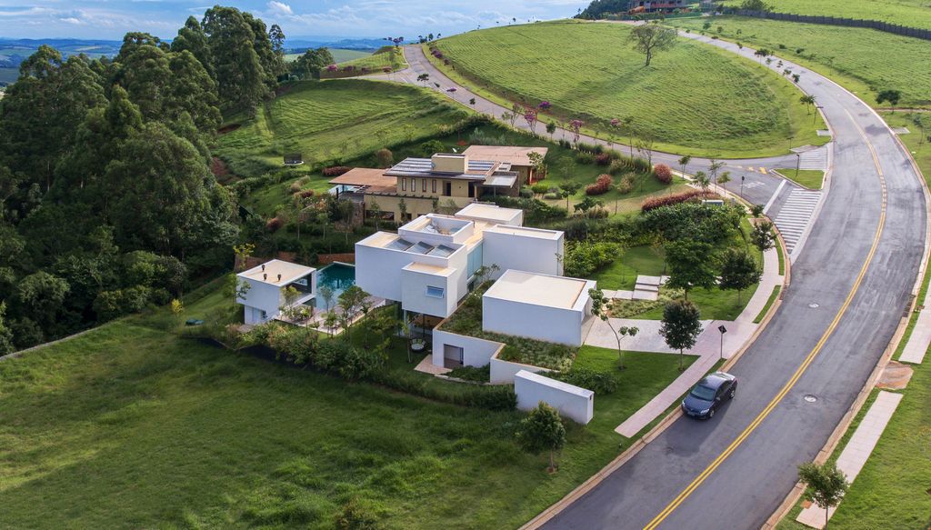 Neblina house stunning white volumes on sloping plot by FGMF Arquitetos 11
