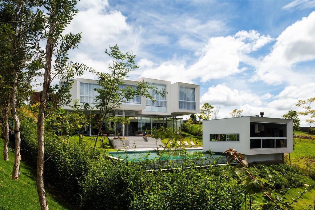 Neblina house stunning white volumes on sloping plot by FGMF Arquitetos 15