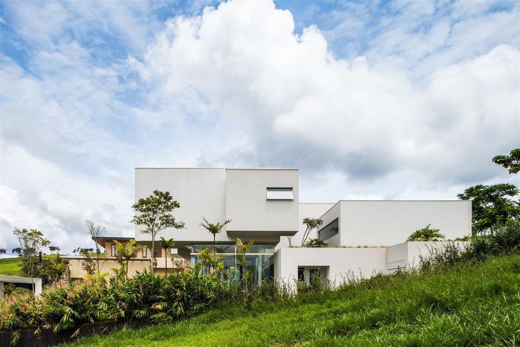 Neblina house stunning white volumes on sloping plot by FGMF Arquitetos 17