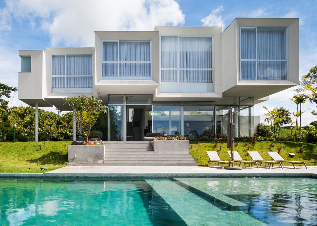 Neblina house stunning white volumes on sloping plot by FGMF Arquitetos 9