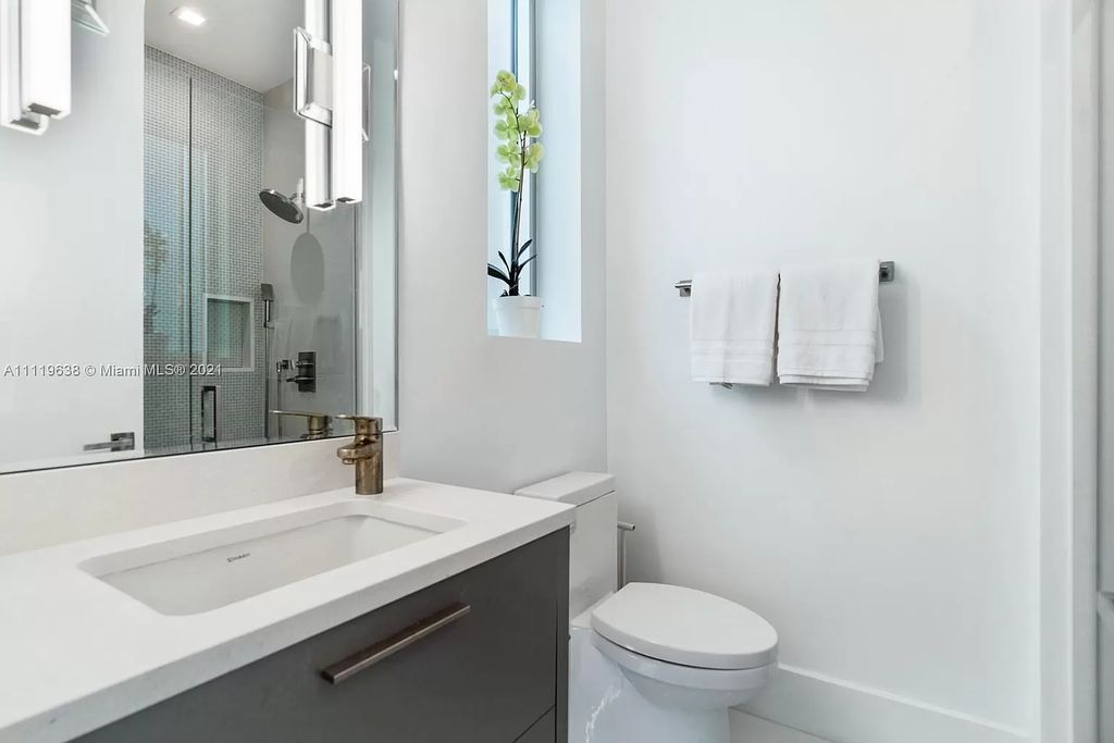 The Miami Beach Home is a stunning new modern construction estate in the esteemed gated Oceanfront community, Altos Del Mar. now available for sale. This house located at 7833 Atlantic Way, Miami Beach, Florida