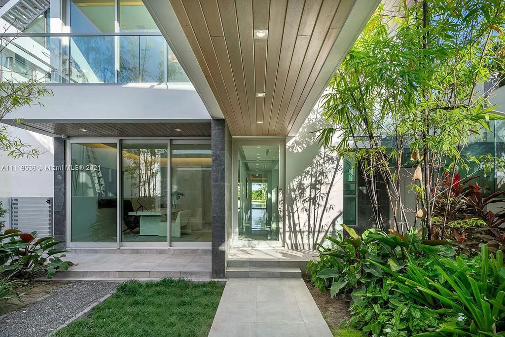 The Miami Beach Home is a stunning new modern construction estate in the esteemed gated Oceanfront community, Altos Del Mar. now available for sale. This house located at 7833 Atlantic Way, Miami Beach, Florida