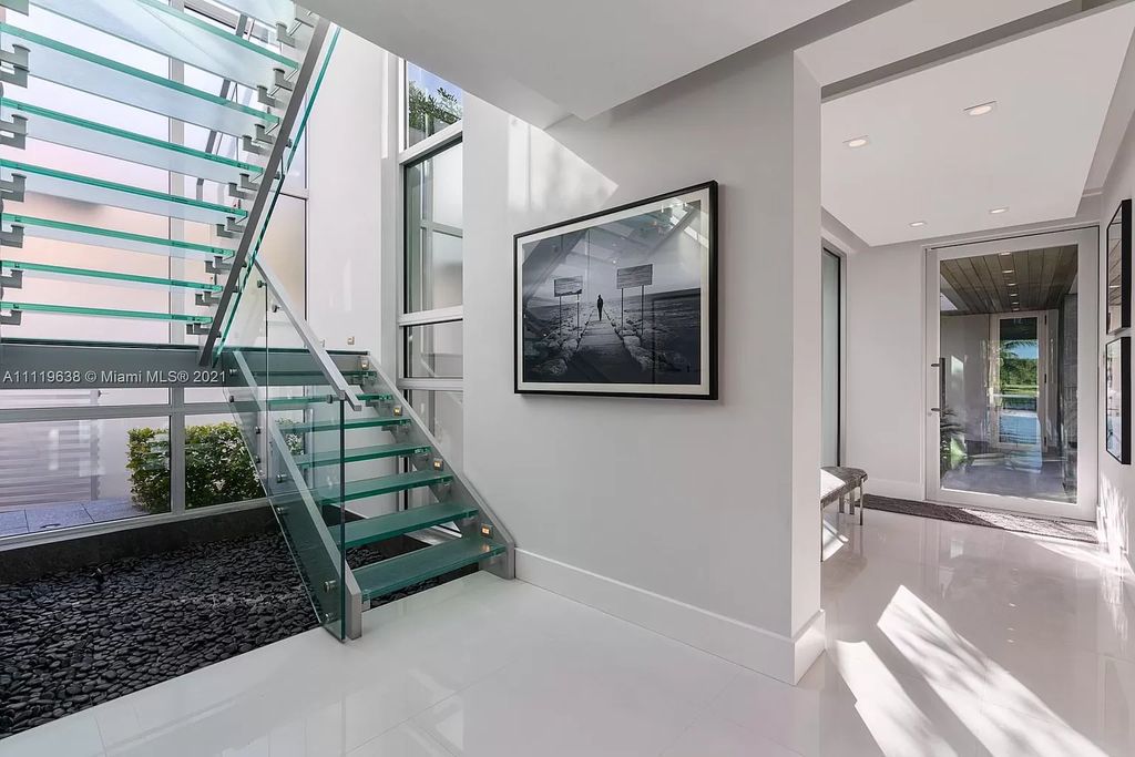 The Miami Beach Home is a stunning new modern construction estate in the esteemed gated Oceanfront community, Altos Del Mar. now available for sale. This house located at 7833 Atlantic Way, Miami Beach, Florida