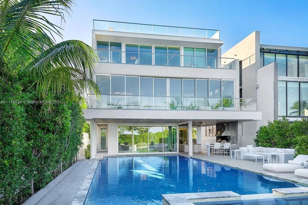 The Miami Beach Home is a stunning new modern construction estate in the esteemed gated Oceanfront community, Altos Del Mar. now available for sale. This house located at 7833 Atlantic Way, Miami Beach, Florida
