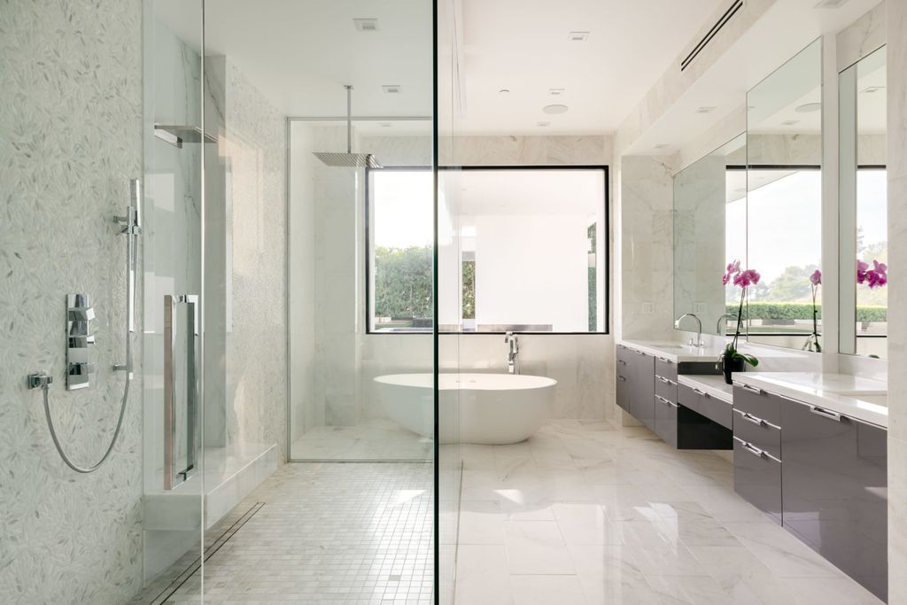 The Home in Beverly Hills is a contemporary masterpiece is built with soaring ceilings, clean lines, and sleek intricacies now available for sale. This home located at 1041 N Hillcrest Rd, Beverly Hills, California
