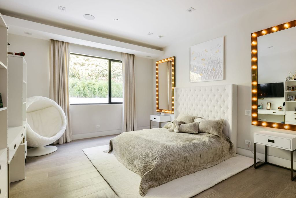 The Home in Beverly Hills is a contemporary masterpiece is built with soaring ceilings, clean lines, and sleek intricacies now available for sale. This home located at 1041 N Hillcrest Rd, Beverly Hills, California