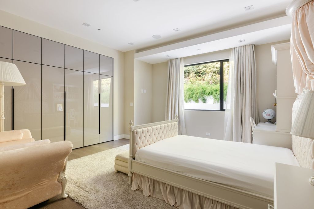 The Home in Beverly Hills is a contemporary masterpiece is built with soaring ceilings, clean lines, and sleek intricacies now available for sale. This home located at 1041 N Hillcrest Rd, Beverly Hills, California