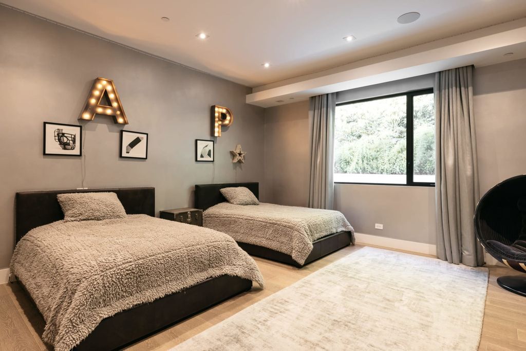 The Home in Beverly Hills is a contemporary masterpiece is built with soaring ceilings, clean lines, and sleek intricacies now available for sale. This home located at 1041 N Hillcrest Rd, Beverly Hills, California