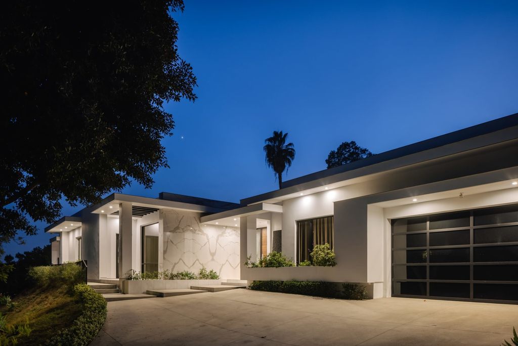 The Home in Beverly Hills is a contemporary masterpiece is built with soaring ceilings, clean lines, and sleek intricacies now available for sale. This home located at 1041 N Hillcrest Rd, Beverly Hills, California
