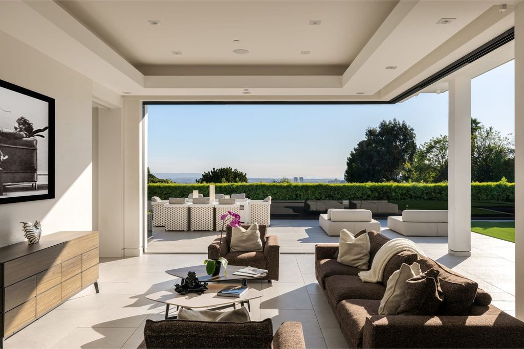 The Home in Beverly Hills is a contemporary masterpiece is built with soaring ceilings, clean lines, and sleek intricacies now available for sale. This home located at 1041 N Hillcrest Rd, Beverly Hills, California