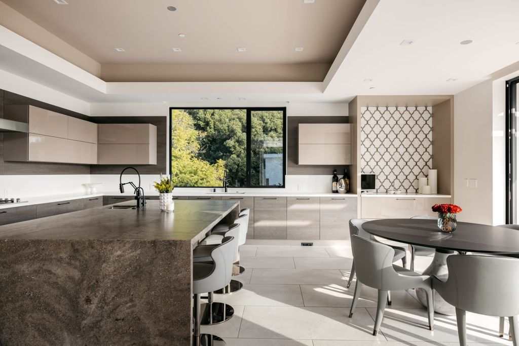 The Home in Beverly Hills is a contemporary masterpiece is built with soaring ceilings, clean lines, and sleek intricacies now available for sale. This home located at 1041 N Hillcrest Rd, Beverly Hills, California