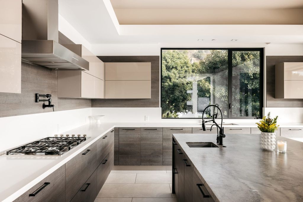 The Home in Beverly Hills is a contemporary masterpiece is built with soaring ceilings, clean lines, and sleek intricacies now available for sale. This home located at 1041 N Hillcrest Rd, Beverly Hills, California