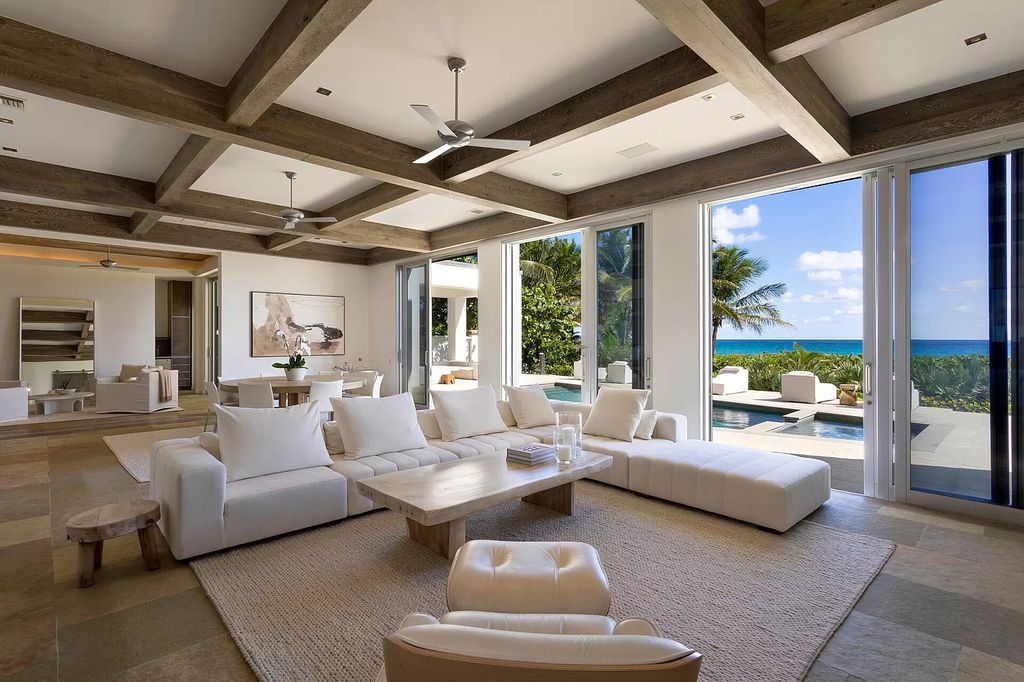 The Home in Delray Beach is sited on lushly landscaped half acre with 110+/- feet directly on the oceanfront now available for sale. This property located at 711 N Ocean Blvd, Delray Beach, Florida