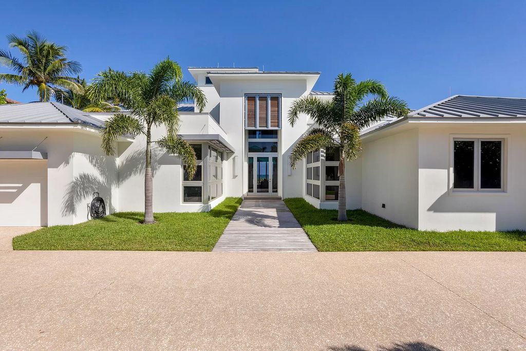The Home in Delray Beach is sited on lushly landscaped half acre with 110+/- feet directly on the oceanfront now available for sale. This property located at 711 N Ocean Blvd, Delray Beach, Florida