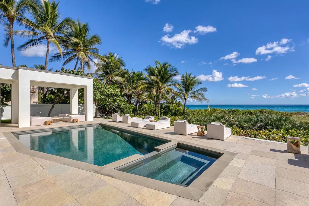 The Home in Delray Beach is sited on lushly landscaped half acre with 110+/- feet directly on the oceanfront now available for sale. This property located at 711 N Ocean Blvd, Delray Beach, Florida