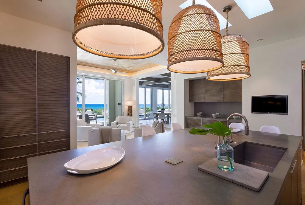 The Home in Delray Beach is sited on lushly landscaped half acre with 110+/- feet directly on the oceanfront now available for sale. This property located at 711 N Ocean Blvd, Delray Beach, Florida