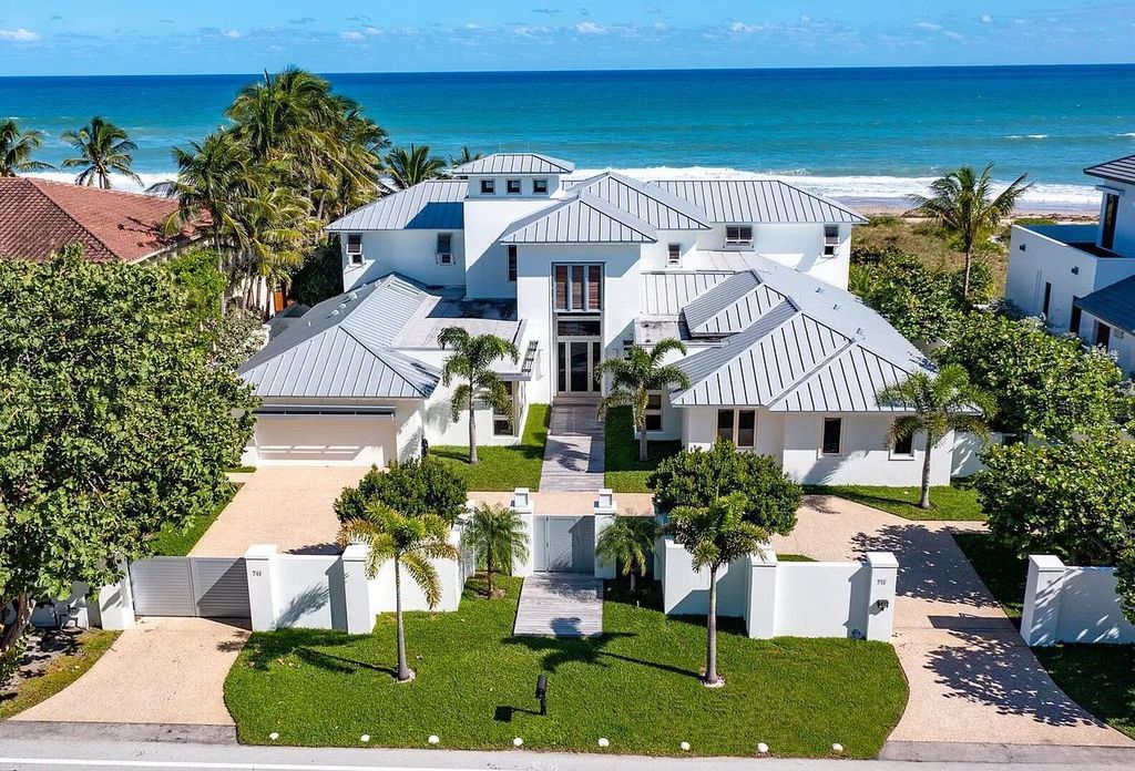 The Home in Delray Beach is sited on lushly landscaped half acre with 110+/- feet directly on the oceanfront now available for sale. This property located at 711 N Ocean Blvd, Delray Beach, Florida