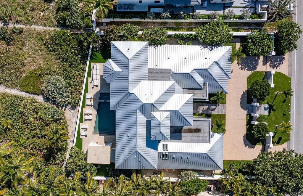 The Home in Delray Beach is sited on lushly landscaped half acre with 110+/- feet directly on the oceanfront now available for sale. This property located at 711 N Ocean Blvd, Delray Beach, Florida