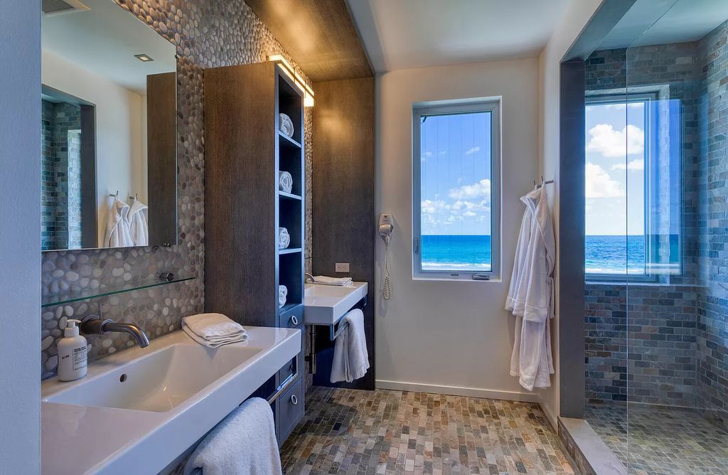 The Home in Delray Beach is sited on lushly landscaped half acre with 110+/- feet directly on the oceanfront now available for sale. This property located at 711 N Ocean Blvd, Delray Beach, Florida