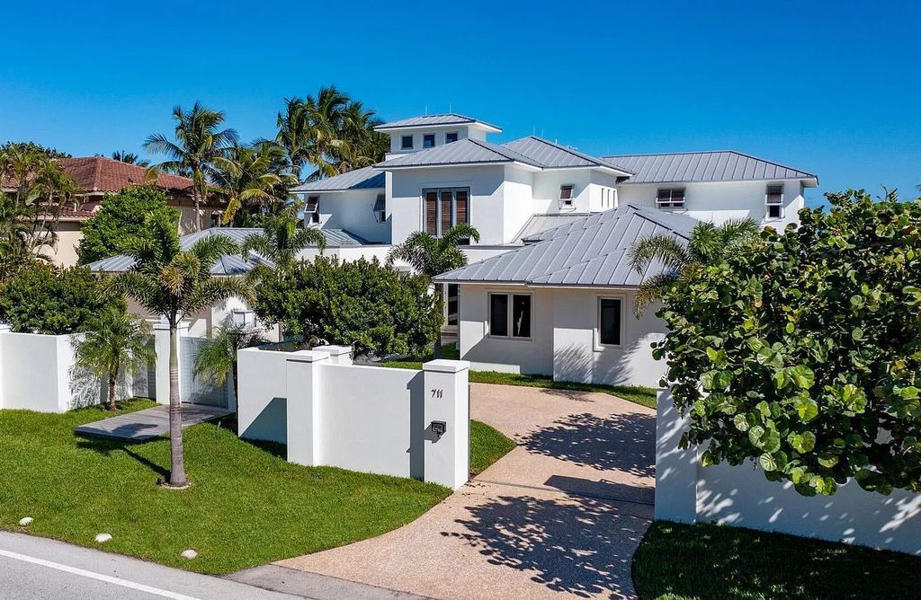 The Home in Delray Beach is sited on lushly landscaped half acre with 110+/- feet directly on the oceanfront now available for sale. This property located at 711 N Ocean Blvd, Delray Beach, Florida