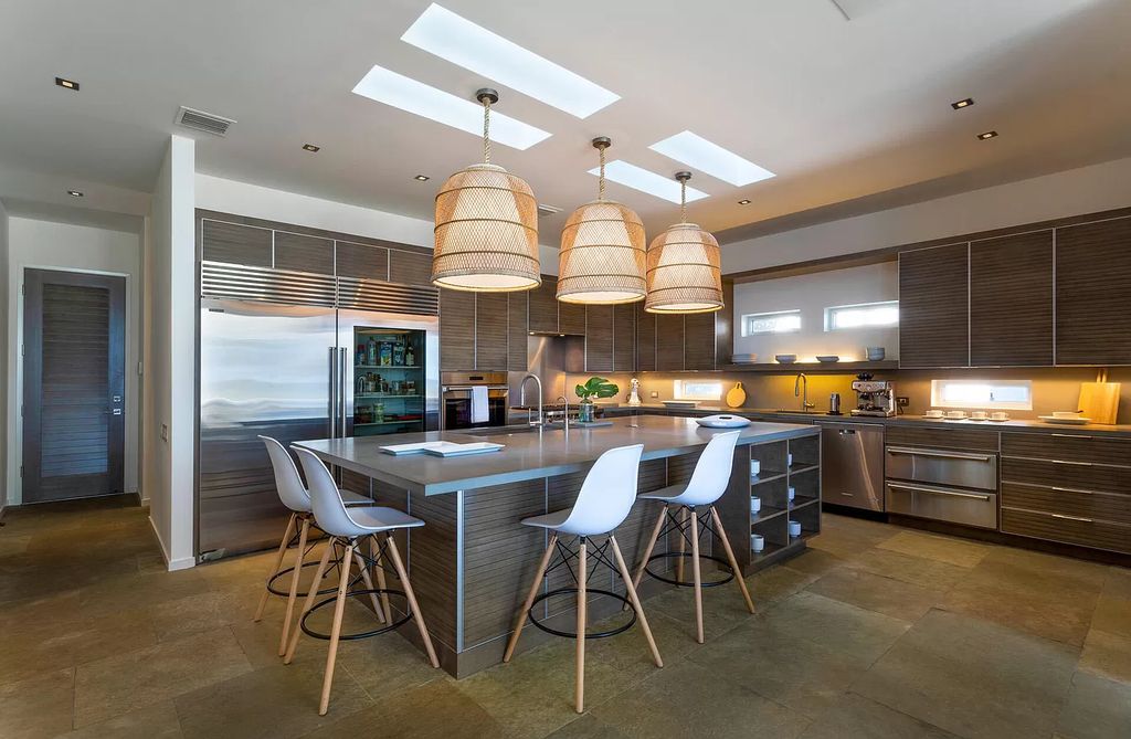 The Home in Delray Beach is sited on lushly landscaped half acre with 110+/- feet directly on the oceanfront now available for sale. This property located at 711 N Ocean Blvd, Delray Beach, Florida