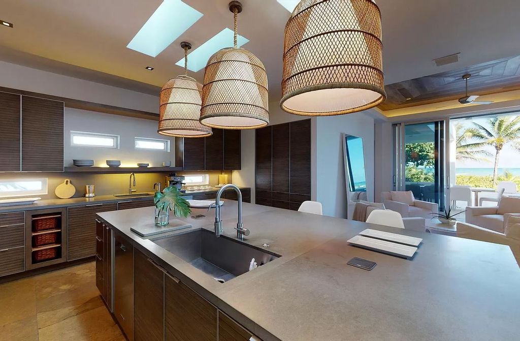 The Home in Delray Beach is sited on lushly landscaped half acre with 110+/- feet directly on the oceanfront now available for sale. This property located at 711 N Ocean Blvd, Delray Beach, Florida