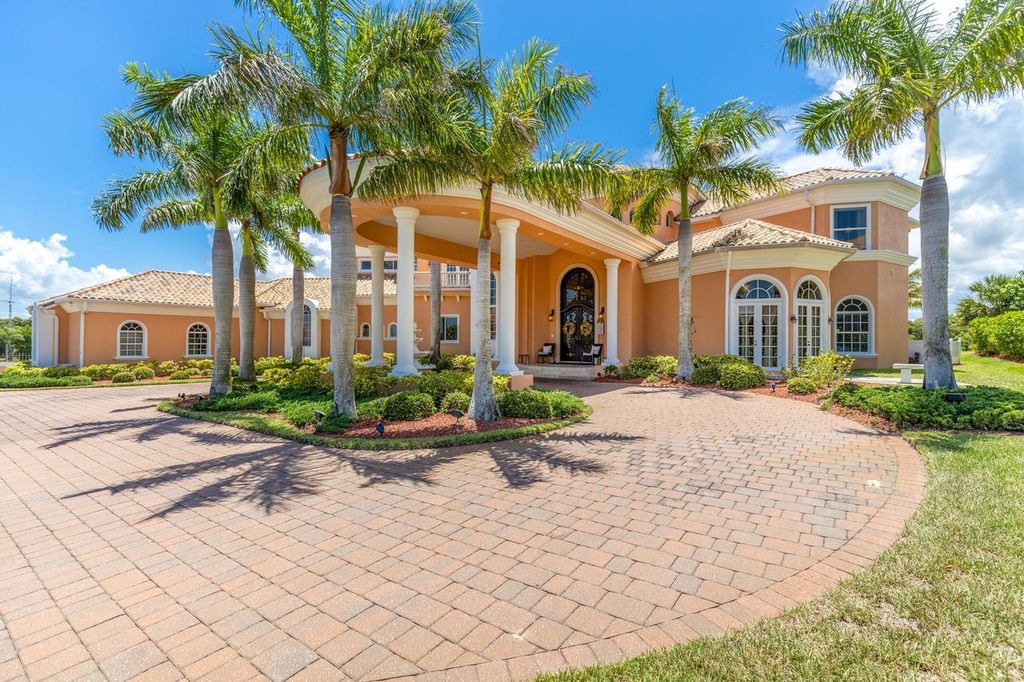 The Home in Merritt Island is a majestic estate home high on a bluff overlooking three bodies of water with stunning panoramic views now available for sale. This home located at 5030 Valle Collina Ln, Merritt Island, Florida