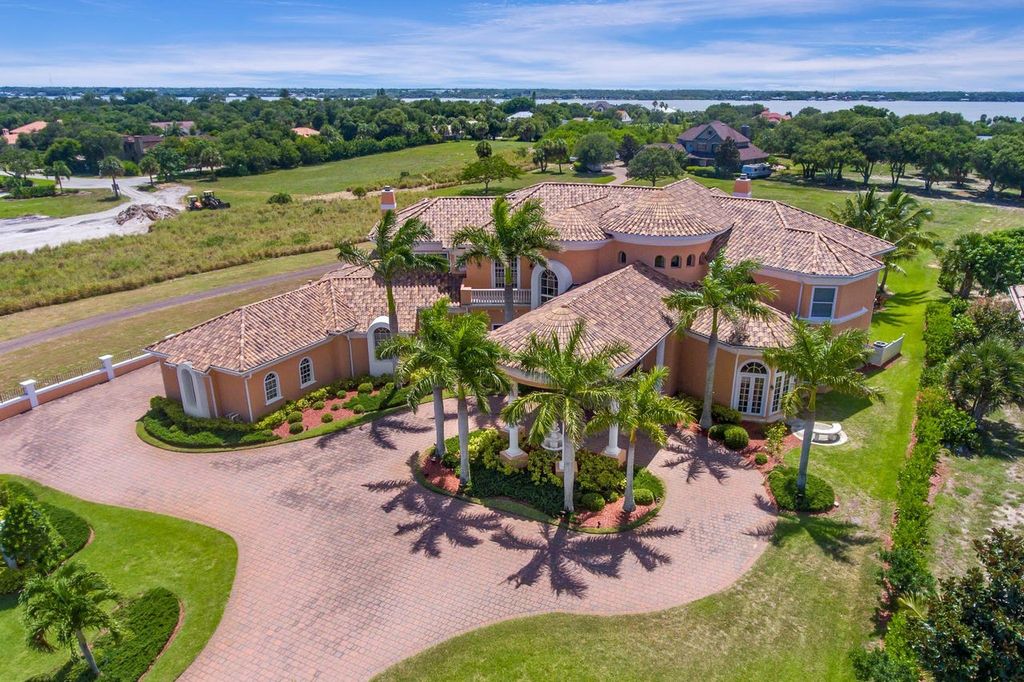 The Home in Merritt Island is a majestic estate home high on a bluff overlooking three bodies of water with stunning panoramic views now available for sale. This home located at 5030 Valle Collina Ln, Merritt Island, Florida