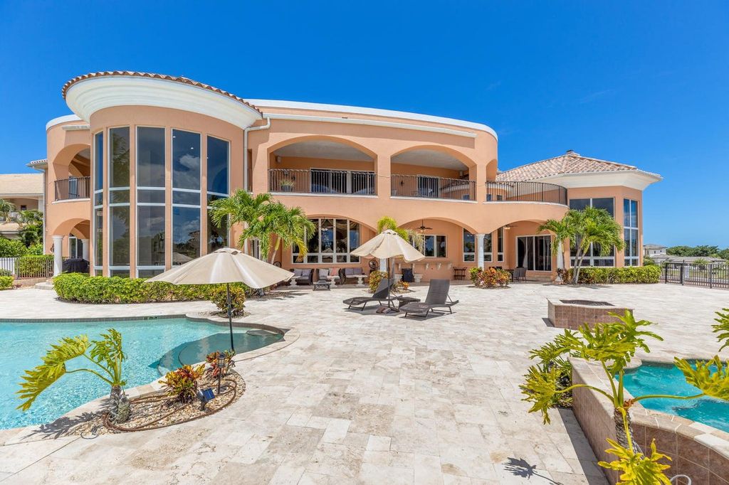 The Home in Merritt Island is a majestic estate home high on a bluff overlooking three bodies of water with stunning panoramic views now available for sale. This home located at 5030 Valle Collina Ln, Merritt Island, Florida
