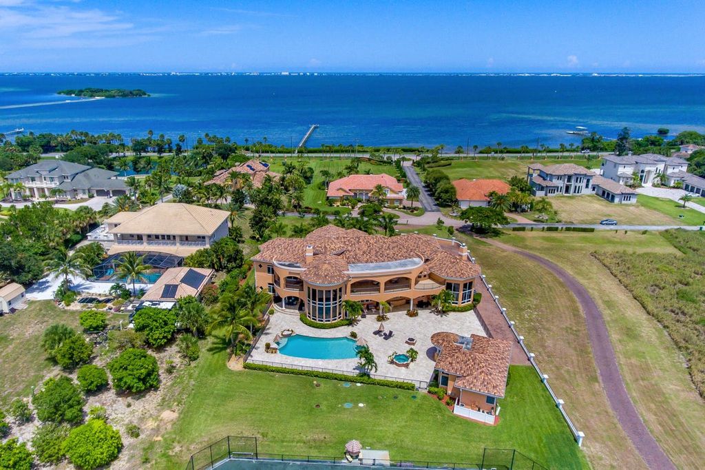 The Home in Merritt Island is a majestic estate home high on a bluff overlooking three bodies of water with stunning panoramic views now available for sale. This home located at 5030 Valle Collina Ln, Merritt Island, Florida