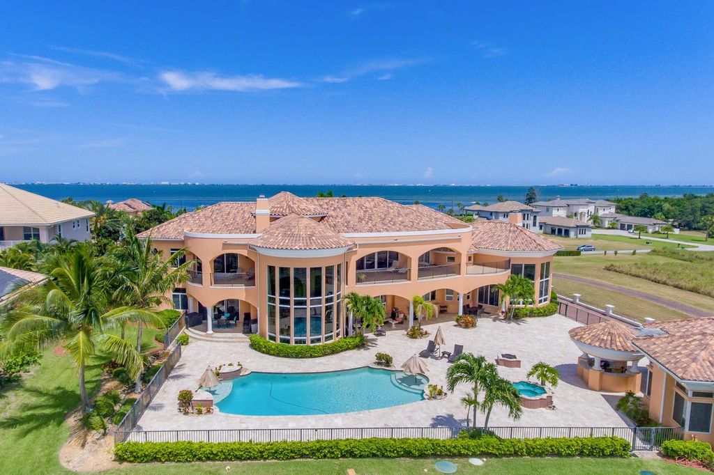 The Home in Merritt Island is a majestic estate home high on a bluff overlooking three bodies of water with stunning panoramic views now available for sale. This home located at 5030 Valle Collina Ln, Merritt Island, Florida