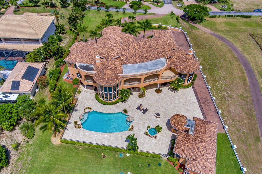 The Home in Merritt Island is a majestic estate home high on a bluff overlooking three bodies of water with stunning panoramic views now available for sale. This home located at 5030 Valle Collina Ln, Merritt Island, Florida