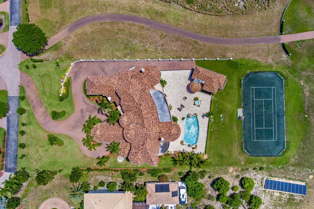 The Home in Merritt Island is a majestic estate home high on a bluff overlooking three bodies of water with stunning panoramic views now available for sale. This home located at 5030 Valle Collina Ln, Merritt Island, Florida