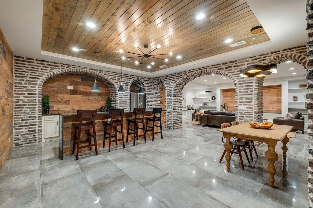 The Tennessee Home is a luxurious home on 2 acres featuring sophisticated lighting, oversized windows and a jaw-dropping pool now available for sale. This home located at 5026 Franklin Pike, Nashville, Tennessee; offering 06 bedrooms and 13 bathrooms with 14,021 square feet of living spaces.