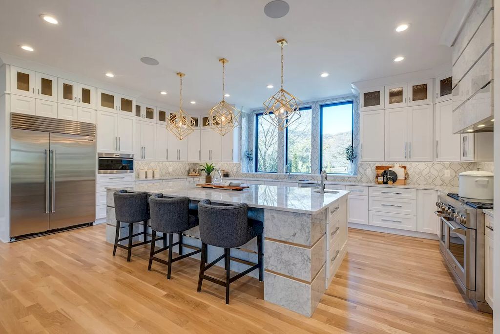 The Tennessee Home is a luxurious home on 2 acres featuring sophisticated lighting, oversized windows and a jaw-dropping pool now available for sale. This home located at 5026 Franklin Pike, Nashville, Tennessee; offering 06 bedrooms and 13 bathrooms with 14,021 square feet of living spaces.