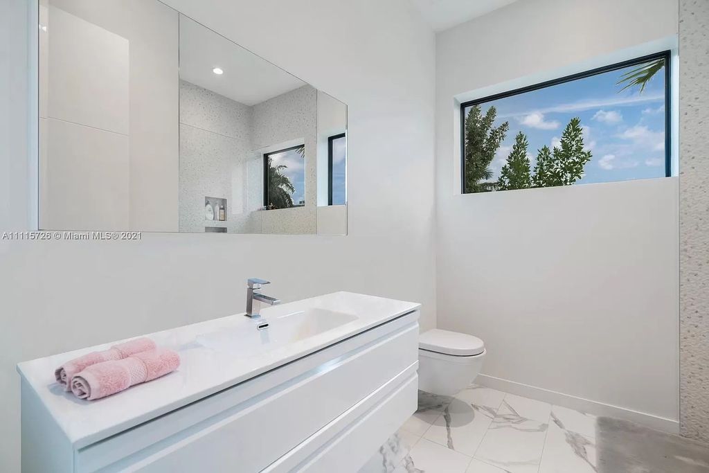 The Home in Miami is a tropical modern estate built with top level finish with breathtaking open floor plan of living spaces now available for sale. This home located at 7333 Belle Meade Blvd, Miami, Florida