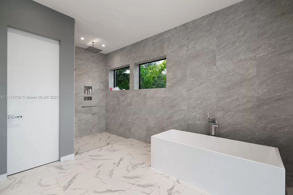 The Home in Miami is a tropical modern estate built with top level finish with breathtaking open floor plan of living spaces now available for sale. This home located at 7333 Belle Meade Blvd, Miami, Florida