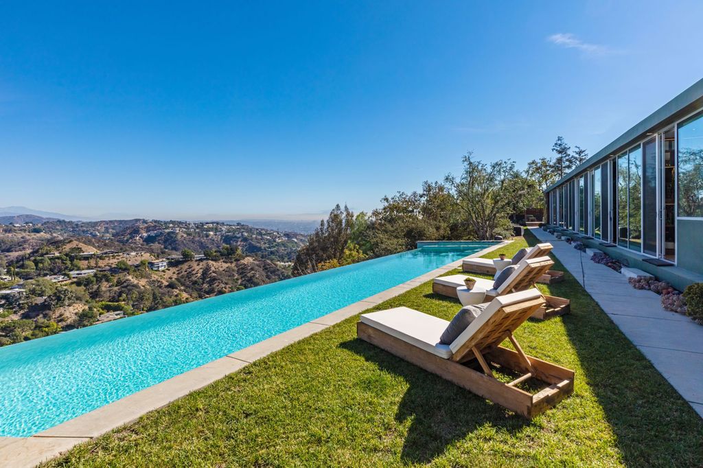 The Los Angeles Home is a hilltop sanctuary nestled on 1.5 picturesque acres perched above Laurel Canyon and built by AIA award-winning architect Hagy Belzberg now available for sale. This home located at 8520 Skyline Dr, Los Angeles, California
