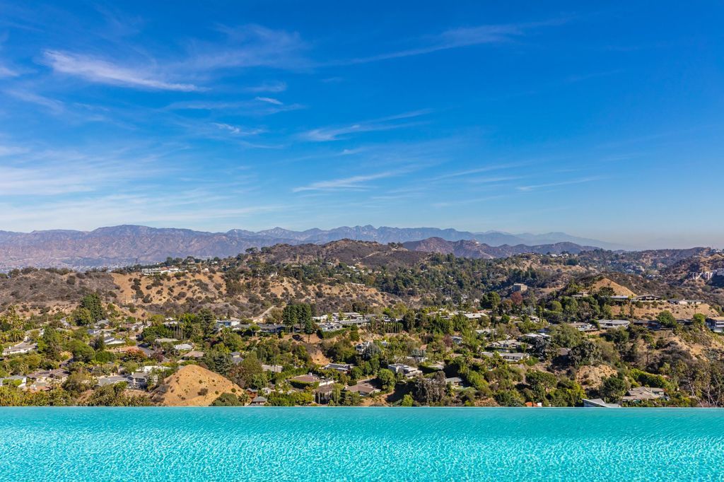 The Los Angeles Home is a hilltop sanctuary nestled on 1.5 picturesque acres perched above Laurel Canyon and built by AIA award-winning architect Hagy Belzberg now available for sale. This home located at 8520 Skyline Dr, Los Angeles, California