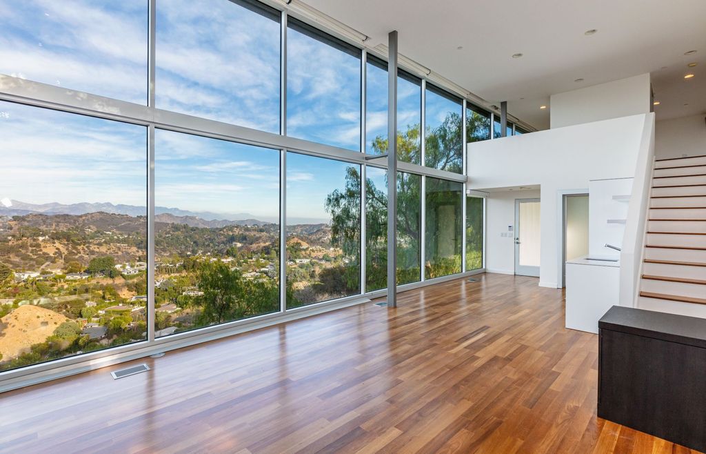 The Los Angeles Home is a hilltop sanctuary nestled on 1.5 picturesque acres perched above Laurel Canyon and built by AIA award-winning architect Hagy Belzberg now available for sale. This home located at 8520 Skyline Dr, Los Angeles, California