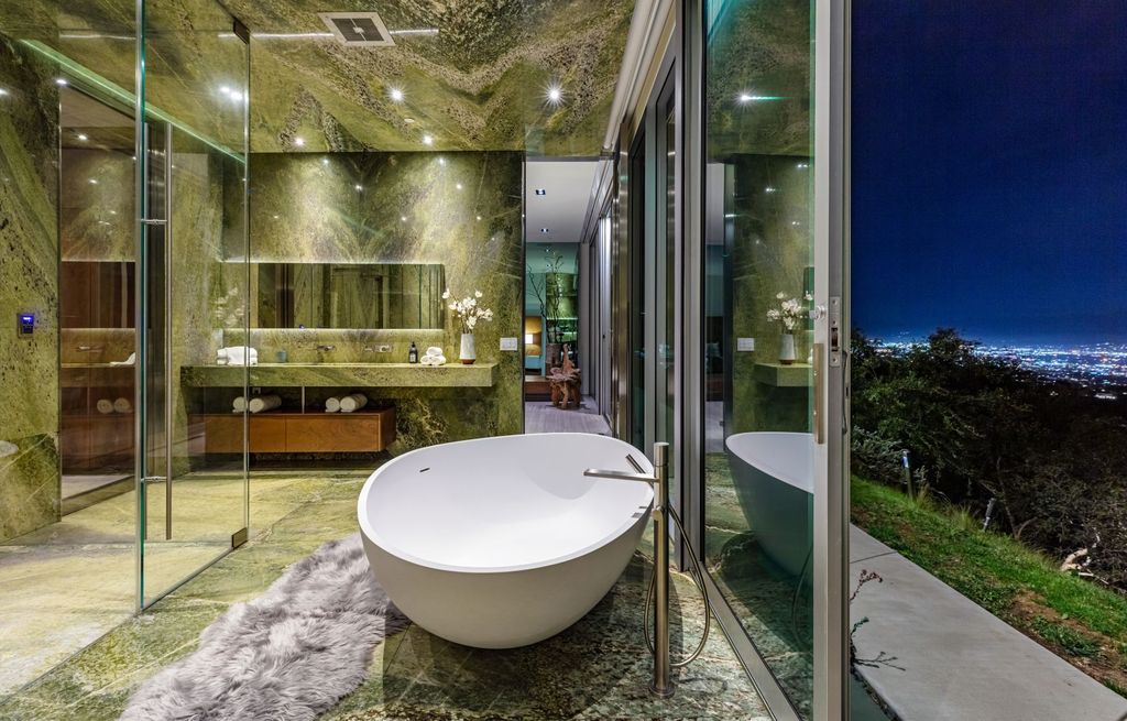 The Los Angeles Home is a hilltop sanctuary nestled on 1.5 picturesque acres perched above Laurel Canyon and built by AIA award-winning architect Hagy Belzberg now available for sale. This home located at 8520 Skyline Dr, Los Angeles, California