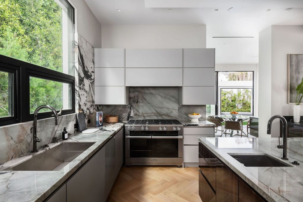 The Home in Beverly Hills is a contemporary new-build, designed by Gabbay Architects is sited behind mature olive trees now available for sale. This home located at 1729 Angelo Dr, Beverly Hills, California